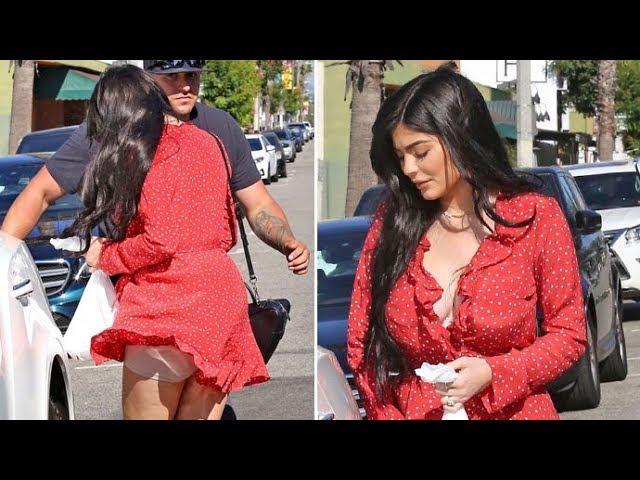 Kylie Jenner Flashes Her Spanx As A Gust Of Wind Lifts Up Her Tiny Red Dress!