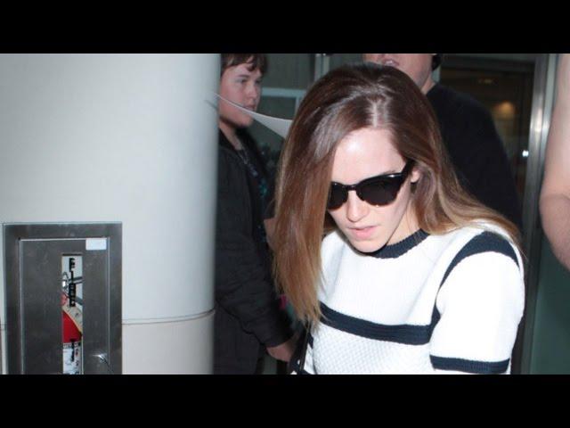 Emma Watson Wears Stripes And Evades Fans At LAX