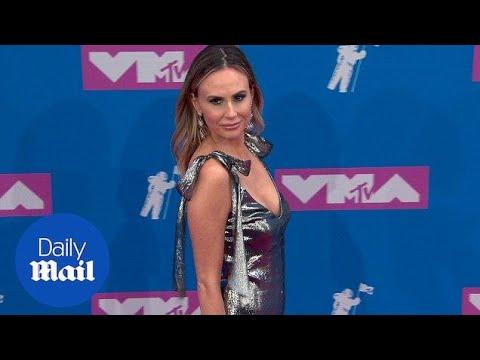 Keltie Knight in a silver dress sparkles like a suit of armor