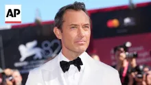 Jude Law and Alicia Vikander walk Venice red carpet for 'The Wizard of the Kremlin'