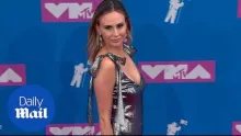 Keltie Knight in a silver dress sparkles like a suit of armor