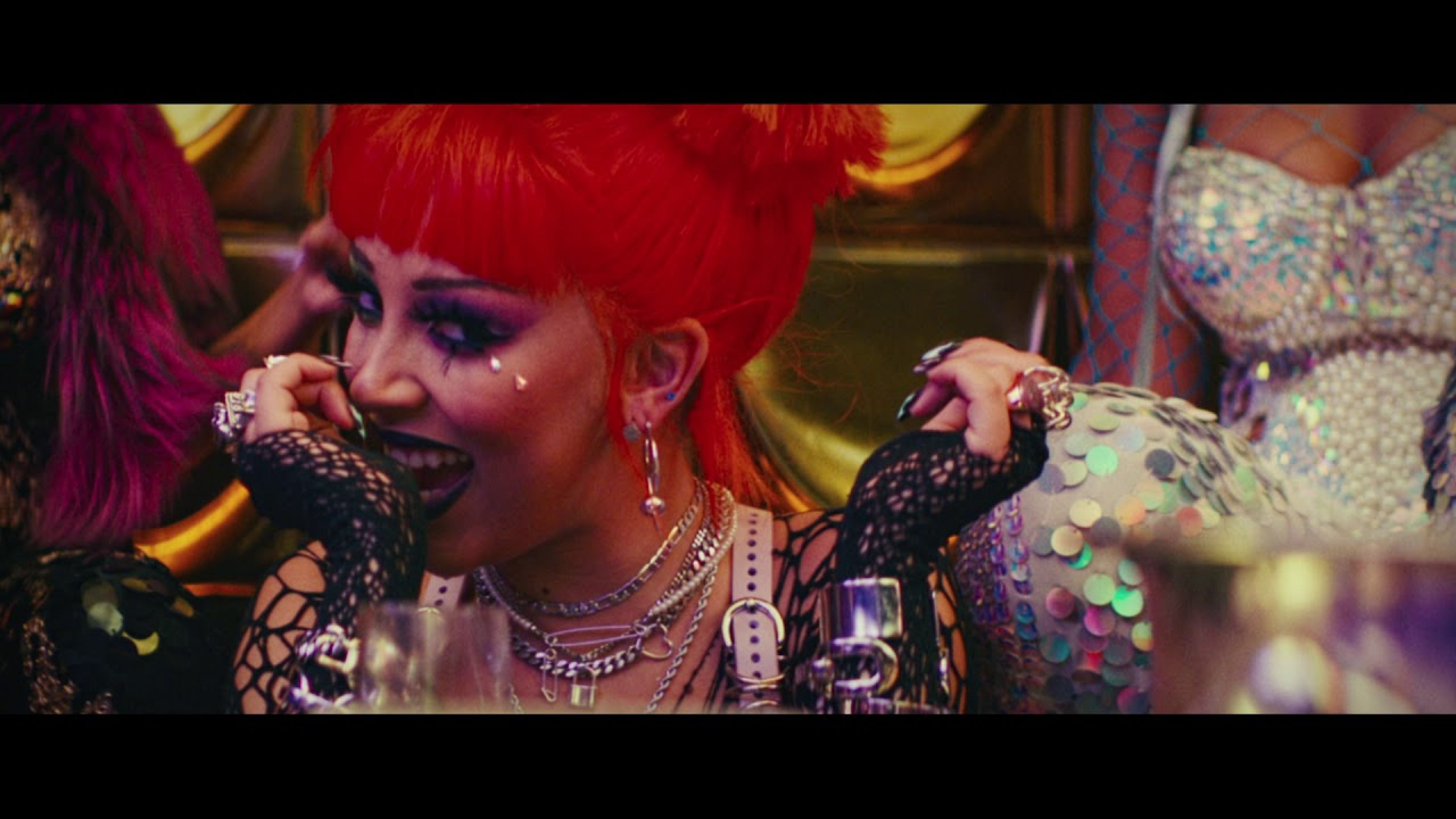 Leather harness bra w/ tassles of Doja Cat in her Boss Bitch Music video.