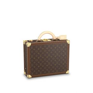 TravisScott is surrounded by @louisvuitton luggage & #lv bag, and