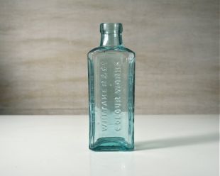 Antique bottle. Whitaker Colour Works, Kendal, England. Vintage aqua glass. Primitive English medicine bottle. Vase.
