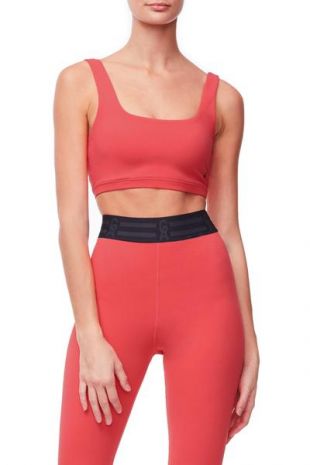 Khloé Kardashian - Strong in my Good American coral sports bra and