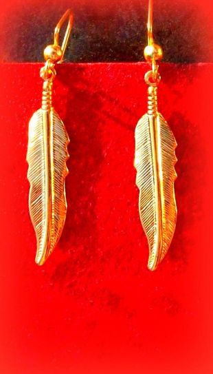 Grandes boucles d'oreilles plumes dorées