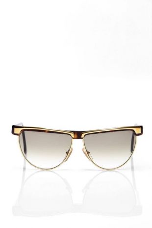 Missoni sunglasses feature tortoiseshell and gold metal frames with gradient grey lenses