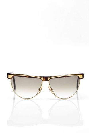 Missoni sunglasses feature tortoiseshell and gold metal frames with gradient grey lenses