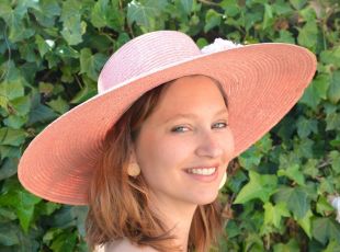 Pink straw wedding hat, green feather and pink flower to accessorize wedding
