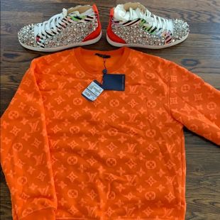 Louis Vuitton Orange Monogram sweater worn by Lil Uzi Verts on his
