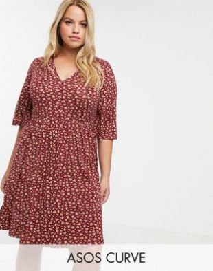 ASOS DESIGN Curve - Robe fluide courte boutonnée sur le devant avec motif floral | ASOS