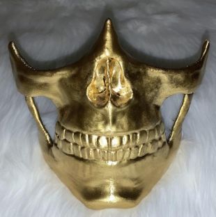The trademark gold mask of Troy Baker in the Death Stranding