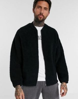 Oversized bomber jacket in black teddy
