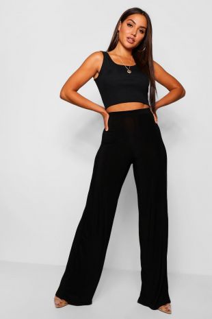 Pantalons coupe large près du corps taille haute