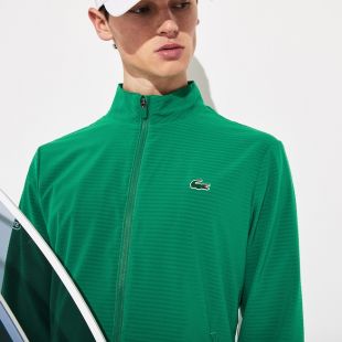 The tracksuit green Lacoste worn by Moha The Dogfish shark in her video Amsterdam | Spotern