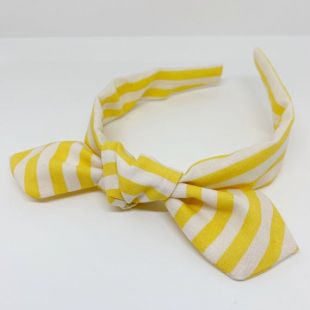 Accessoire jaune de cheveux de bandeau de bandeau de arc