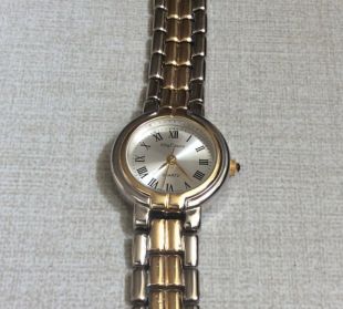 Oleg Cassini Women's Watch Small Silver Round Dial with Roman Numeral Hours on a Two-Tone Linked Band vintage In Mint Condition Watch Beauty