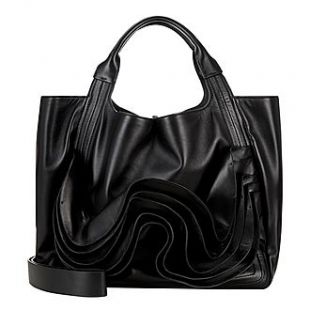 VALENTINO GARAVANI Atelier Tote bag worn by Poppy Delevingne in the YouTube video Poppy Delevingne: In Bag | 35 British Vogue & Valentino | Spotern
