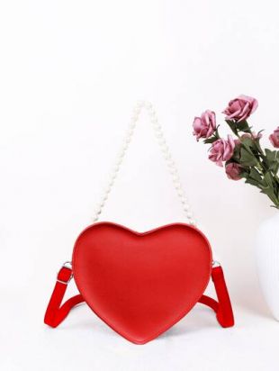 Fran Fine S03E13 - Fran Drescher (Fran Fine) is holding a red Moschino heart-shaped  bag - #90sRunwayFashion #Fine #Fra…