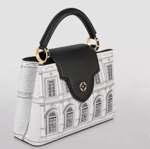 Louis Vuitton Fornasetti Leather Architettura Capucines BB Top-Handle Bag  worn by Enid Frick (Candice Bergen) as seen in And Just Like That… (S02E04)