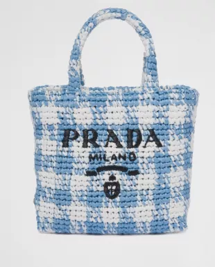Gigi Hadid carries a Prada crochet bag @ JFK Airport July 25, 2023