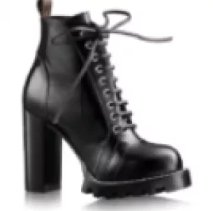 Louis Vuitton Star Trail Ankle Boot Black worn by Taylor Swift in New York  City on October 15, 2023