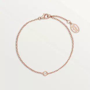 Bracelet Cartier d'Amour, or rose 750/1000, serti d'un diamant taille brillant pour 0,04 carat. Épaisseur