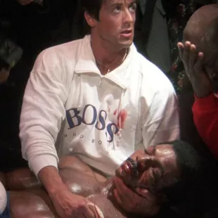 Hugo Boss 1/4 zip sweat­shirt in white worn by Rocky Bal­boa (Sylvester Stal­lone) in Rocky IV movie