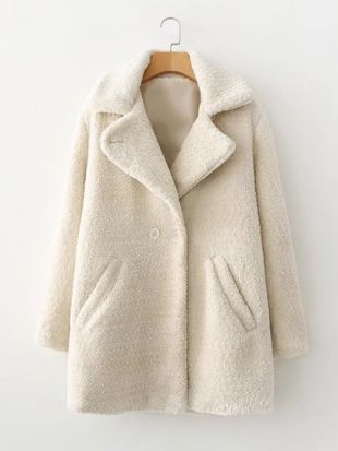 Manteau avec fourrure fausse et double rangées des boutons