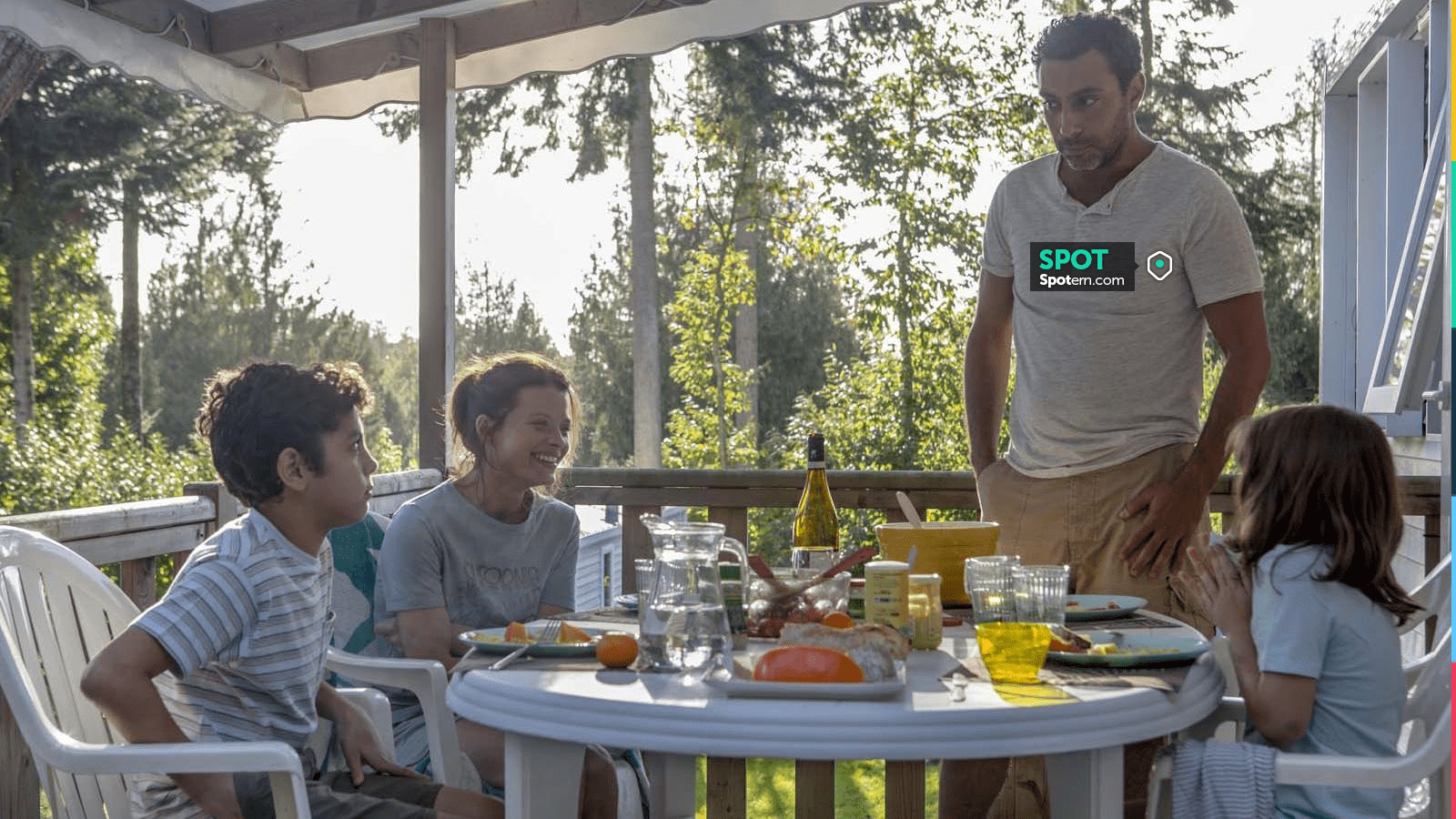 The beige henley t-shirt worn by Driss (Lyes Salem) in the film