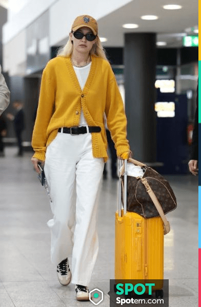 Gigi Hadid in white Adidas sneakers with black sweater and black orange  leggings ~ I want her style - What celebrities wore and where to buy it.  Celebrity Style
