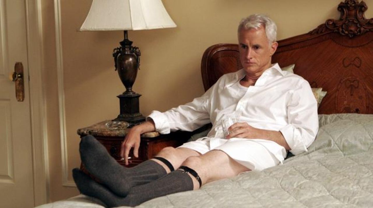 The authentic straps to socks Roger Sterling (John Slattery) in Mad Men.