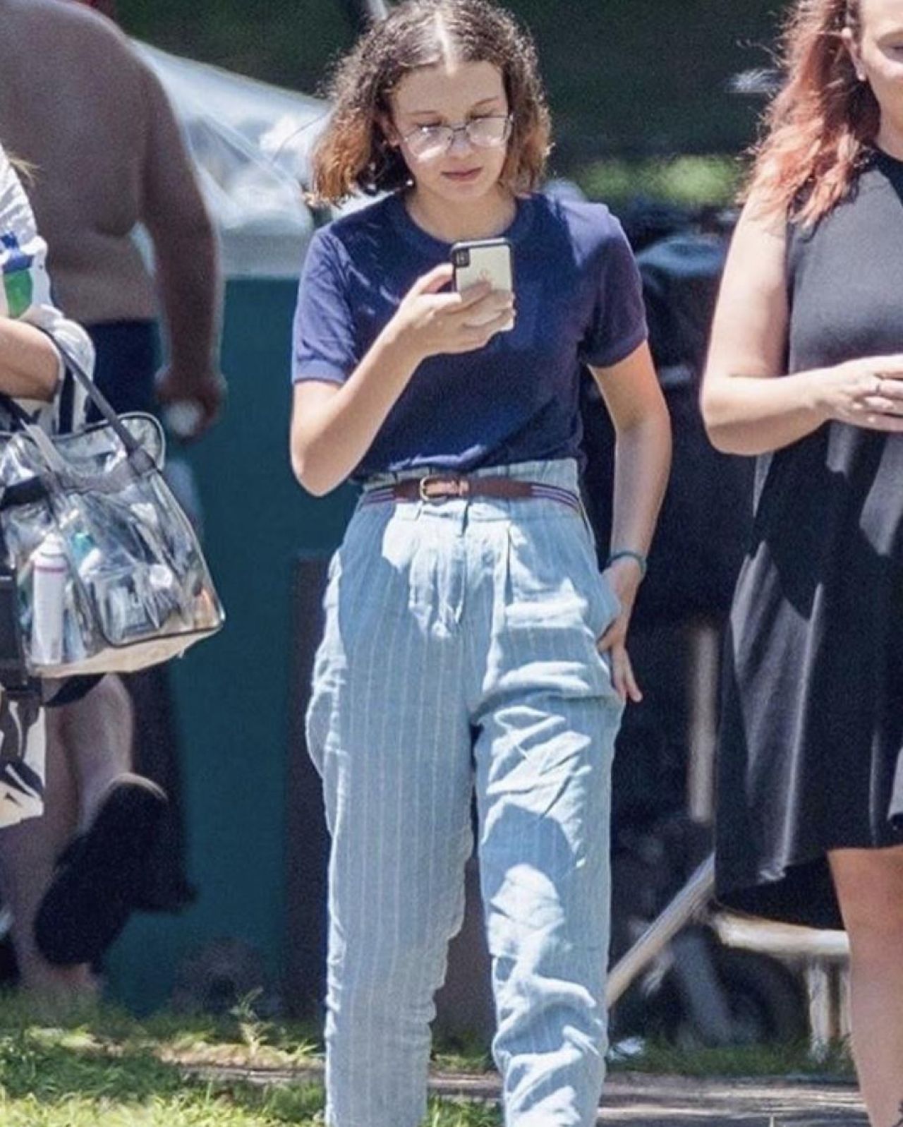 Striped or pleated Jeans / Pants worn by Millie Bobby Brown on the set of S...