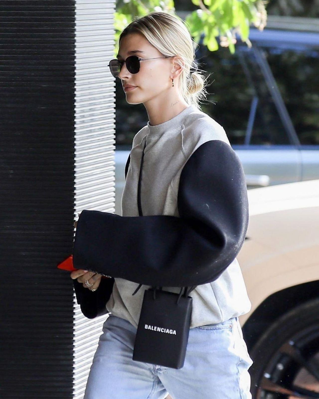 Balenciaga Phone Holder Bag worn by Hailey Bieber Honor Bar January 9