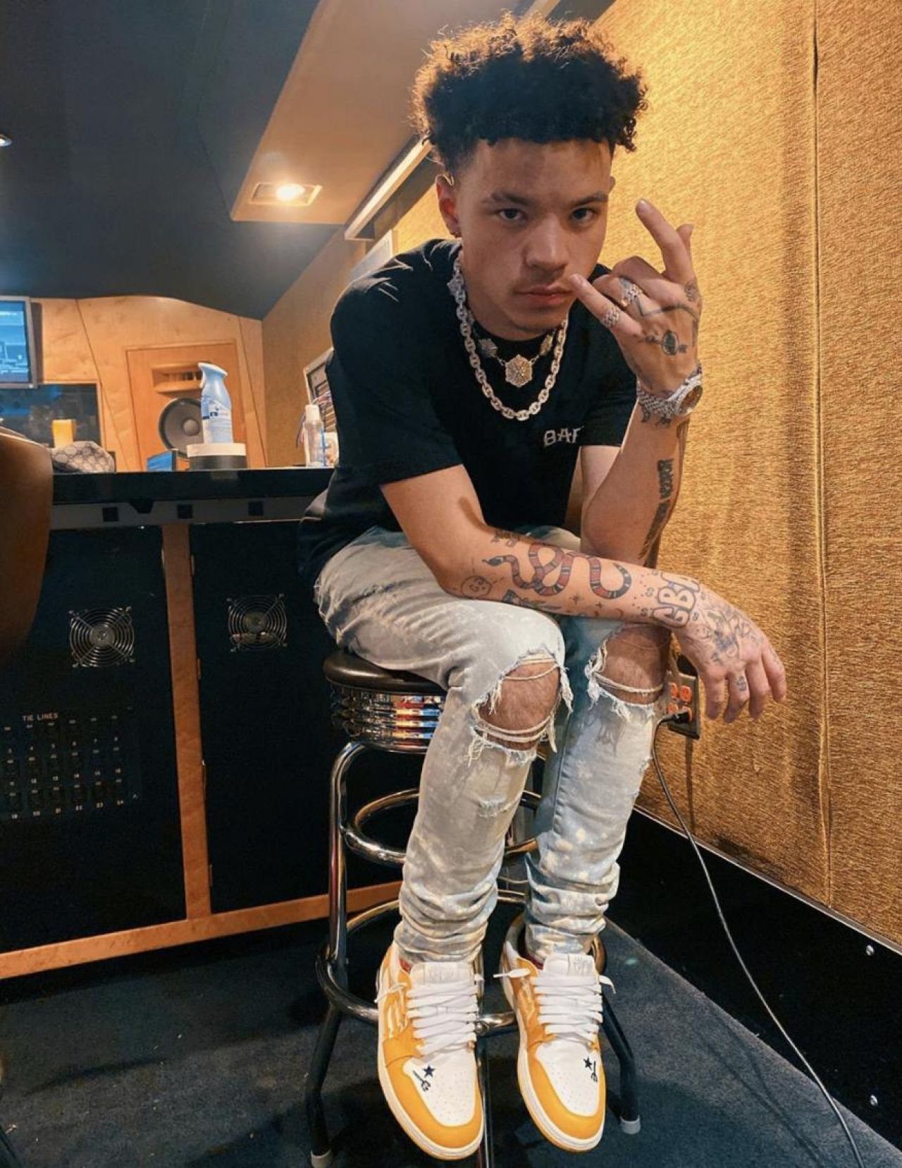 Yellow shoes worn by Lil Mosey on his Instagram account @lilmosey.