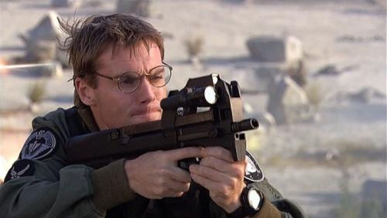 The replica of the assault rifle P90 Dr. Daniel Jackson (Michael Shanks) in...