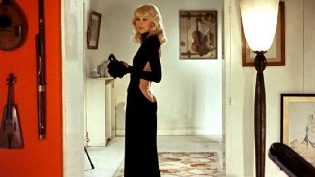 The black dress Guy Laroche-neckline in the back of Mireille Darc in ...