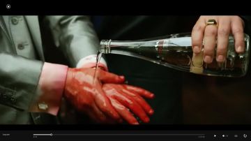 The bottle of Evian water to Mr Jang in Lucy