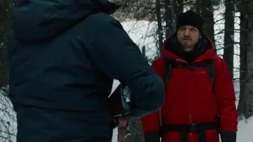 The red Arc'teryx parka coat worn by Aaron Cross (Jeremy Renner) in the movie The Bourne Legacy