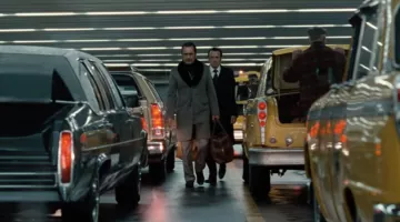 Le manteau gris doublé de Gaëtan Zampa aka Tany (Gilles Lellouche) dans le film La French