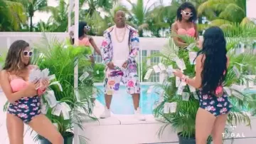 The swimsuit floral print of the dancers in the clip Rake It Up Yo Gotti