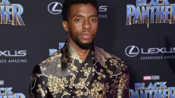 The jacket black and gold of Chadwick Boseman at the premiere of Black Panther
