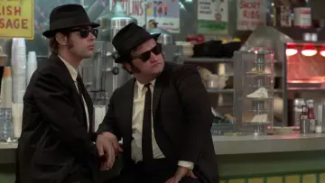 The black hat Trilby Elwood Blues (Dan Aykroyd) and 'Joliet' Jake Blues (John Belushi) in The Blues Brothers