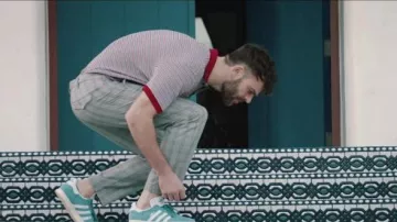 The Adidas sneakers blue seen in the movie clip You Owe Me by The Chainsmokers