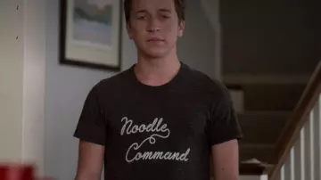 The grey Noodle Command tee-shirt  seen on Eric Bernis (Skyler Gisondo) in Santa Clarita Diet S02E01