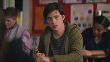 Khaki green polo worn by Si­mon Spier (Nick Ro­bin­son) as seen in Love, Si­mon