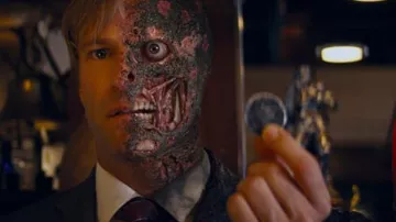 Two-Face's coin of Harvey Dent (Aaron Eckhart) as seen in The Dark Knight