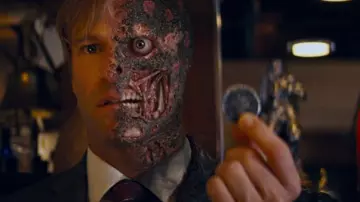 Two-Face's coin of Harvey Dent (Aaron Eckhart) as seen in The Dark Knight