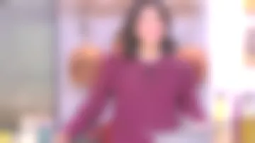 Le Top en tartan à encolure montante de Farida dans La quotidienne du 08/12/2017