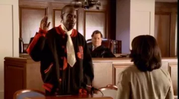 The leather jacket style teddy, black, and red of Omar in The wire